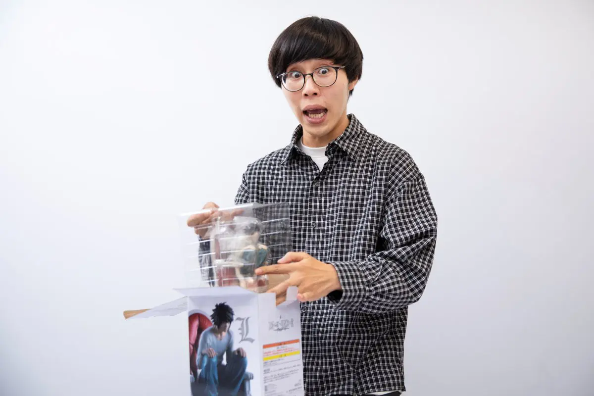 B賞を開封するたかやさん